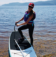 Photo of woman paddle boarding